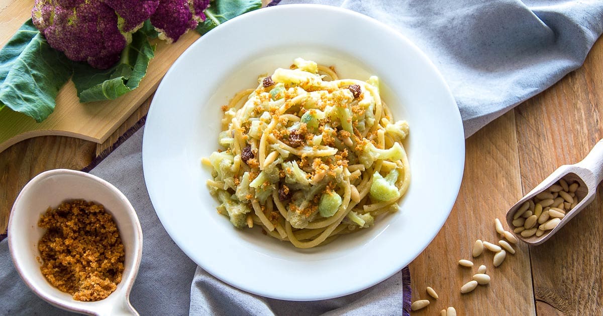 Bowl of homemade Sicilian pasta chi vrocculi arriminati with toppings
