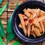 Traditional Asian bamboo dish cooked with fresh ingredients in a home kitchen